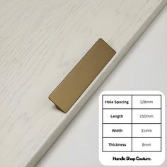 the brass handle is on top of a white wooden surface with measurements for each piece