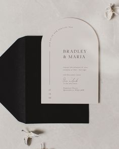 an elegant black and white wedding card