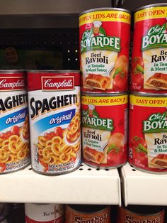 canned spaghetti are on display in a store