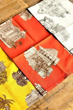 four napkins are folded on top of each other in different colors and designs,