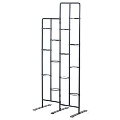 three metal racks with shelves on each side