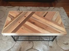 a coffee table made out of wood and metal frame on carpeted area with rug