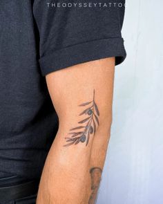 a man with a tattoo on his arm