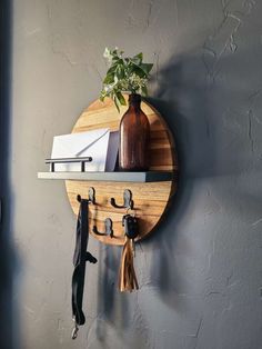 a round wooden shelf with hooks and an umbrella