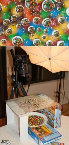 an umbrella and some books on a table next to a camera with bubbles in the background