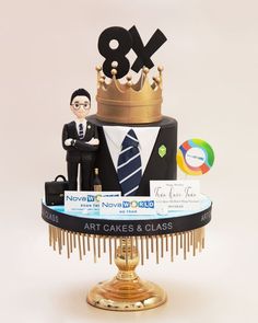 a cake with a man in a suit and tie on it's top tier