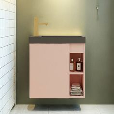 a bathroom with a pink cabinet and white tiles