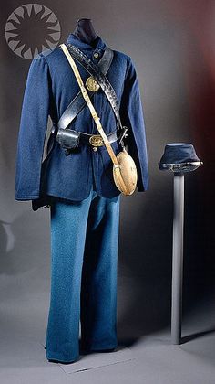 an uniform and hat on display in a museum