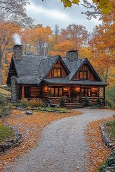 a log cabin in the woods surrounded by fall leaves and trees, with a pathway leading up to it