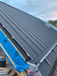 a metal roof being installed on a house