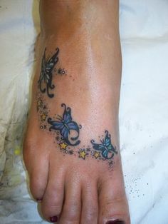 a person with a tattoo on their foot