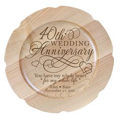 a wooden plate with the words 25th wedding anniversary printed on it