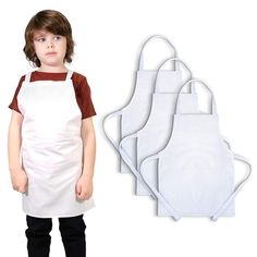 a little boy wearing an apron and standing next to three white bibs