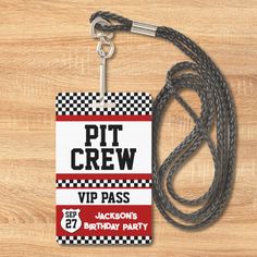 a lanyard with a tag that says pit crew