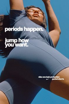 an advertisement for nike sportswear featuring a woman in the air with her arms up