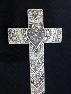 a cross with an intricate design on it