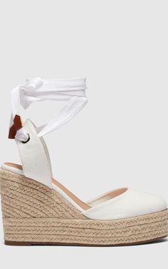 The buenos aries white wedges feature a classic closed toe design with stylish ankle ties, the wedge heel is covered in natural espadrille with a small platform. Upper: 100% synthetic, lining: 100% polyurethane, outsole: 100% rubberwipe clean onlyheel height : 105mm. Summer, sandals, Brunch, Party, Going Out, Basic White Espadrilles Wedges, White Dresses Online, White Party Dresses, White Espadrilles, Shoe Wardrobe, Espadrilles Style, White Wedges, Wedges Shoes, Platform Espadrilles