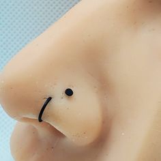 a close up of a fake breast with a black nose