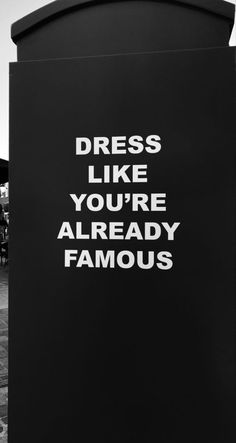 a sign that says dress like you're already famous