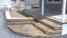 an outdoor patio with steps leading up to the house