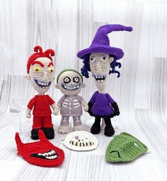 three crocheted dolls are standing next to each other in front of a white background