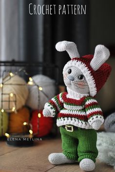 a crocheted bunny is standing on the floor