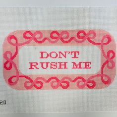 a cross - stitch pattern with the words don't rush me in red and pink