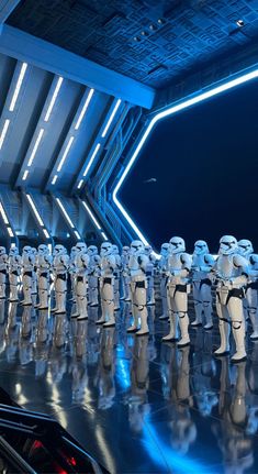 a group of star wars action figures lined up in front of each other on display