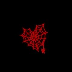 a red spider web on a black background