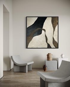 an abstract painting hangs on the wall next to two chairs and a vase in a modern living room