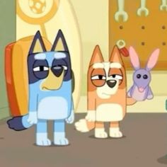 three cartoon dogs standing next to each other in front of a wall with keys on it