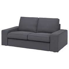 a gray couch sitting on top of a white floor