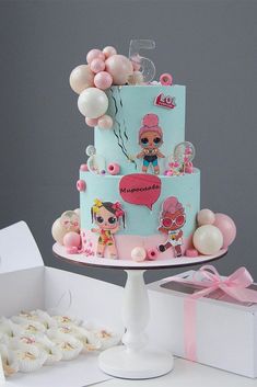 a birthday cake decorated with pink and blue decorations