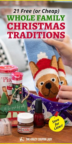 a person holding up a christmas stocking on top of a table with other items