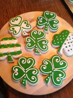 shamrock cookies decorated with white and green icing