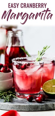 an easy cranberry margarita is served in glasses with garnish