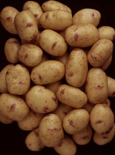 a pile of potatoes sitting on top of a table