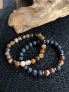 10% OFF when you Favorite this item and you Favorite the shop   EARTH Element Bracelet - Brown Agate & Lava Beads SET OF 2 BRACELETS Ground yourself with our EARTH Element bracelet, featuring rich brown agate stones and grounding lava beads, perfect for essential oil diffusion. These unisex bracelets symbolizes stability and inner strength, making it a thoughtful gift or a calming daily accessory. Options: Single Bracelet (A or B) Duo Set (A+B) Stone Qualities: Brown Agate: Promotes stability, e Earthy Beaded Bracelets With Natural Stones For Meditation, Earthy Gemstone Beads Bracelet For Gift, Earthy Bracelets With Natural Stones For Meditation, Earthy Brown Beaded Bracelets For Meditation, Earth Signs Zodiac, Earth Bracelet, Semi Precious Stone Bracelet, Volcanic Stone, Zodiac Bracelet