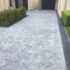 an empty driveway in front of a house