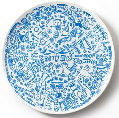 a blue and white plate with various designs on it