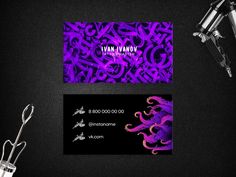 a business card with purple swirls on it and scissors next to it, along with other items