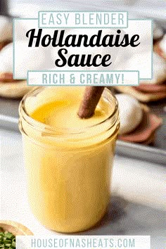 homemade hollandaise sauce in a glass jar with a cinnamon stick sticking out of it