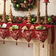 a mantel decorated with christmas decorations and candles