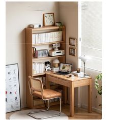 a wooden desk topped with a laptop computer next to a book shelf filled with books