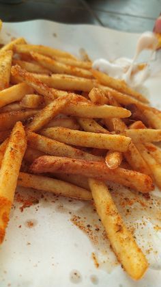 the french fries are seasoned and ready to be eaten