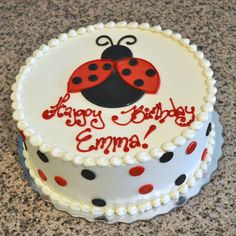 a birthday cake with a ladybug design on it