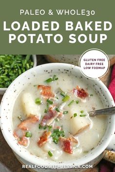 a bowl of loaded baked potato soup with bacon and green onions in it, on top of