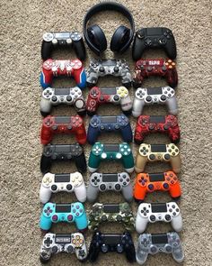 a pile of video game controllers sitting on top of a floor next to each other