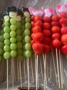 grapes and strawberries are arranged on sticks