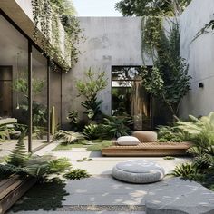 an outdoor courtyard with plants and benches